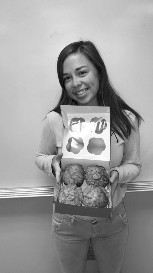 Junior Janessa Klein poses with blueberry muf ns which are her favorite  avor. Caitlin Kramer Photo.