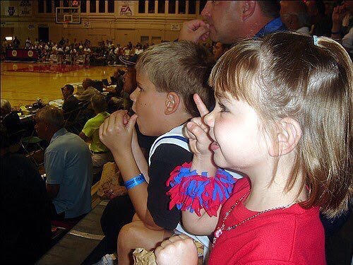 Junior Lauren Nelson (right) and her brother (left) watch the Kansas Jayhawks at the Maui Invitational in Hawaii. Kember Nelson Photo.